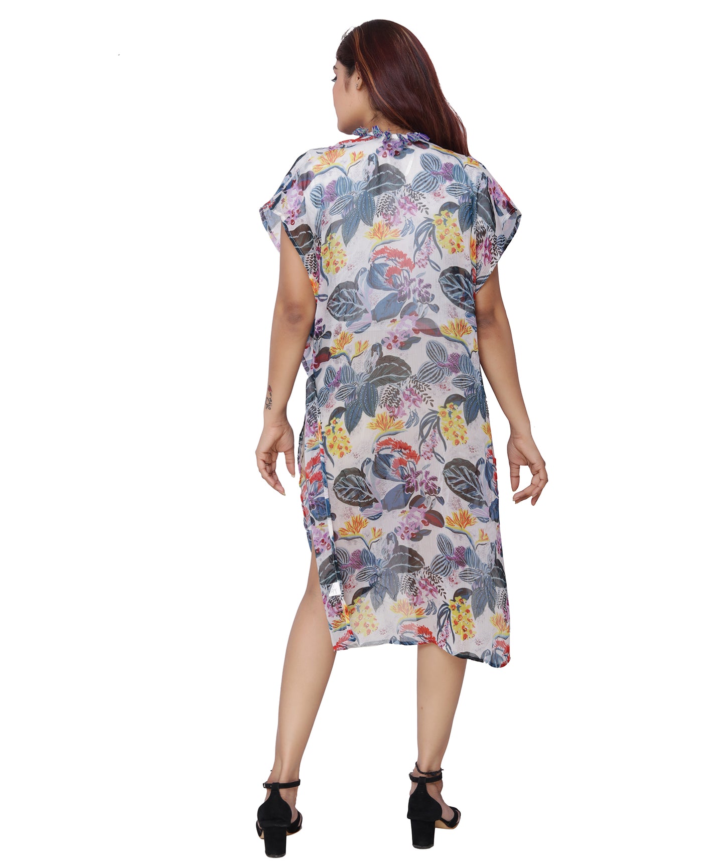 Back view of a floral print polyester shrug coverup, showcasing a full-length flowing design with vibrant flowers.