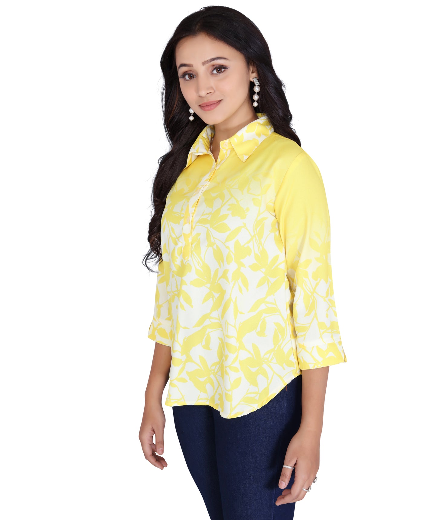 Angled view of a yellow printed polyester top, showcasing its stylish design and breathable fabric.