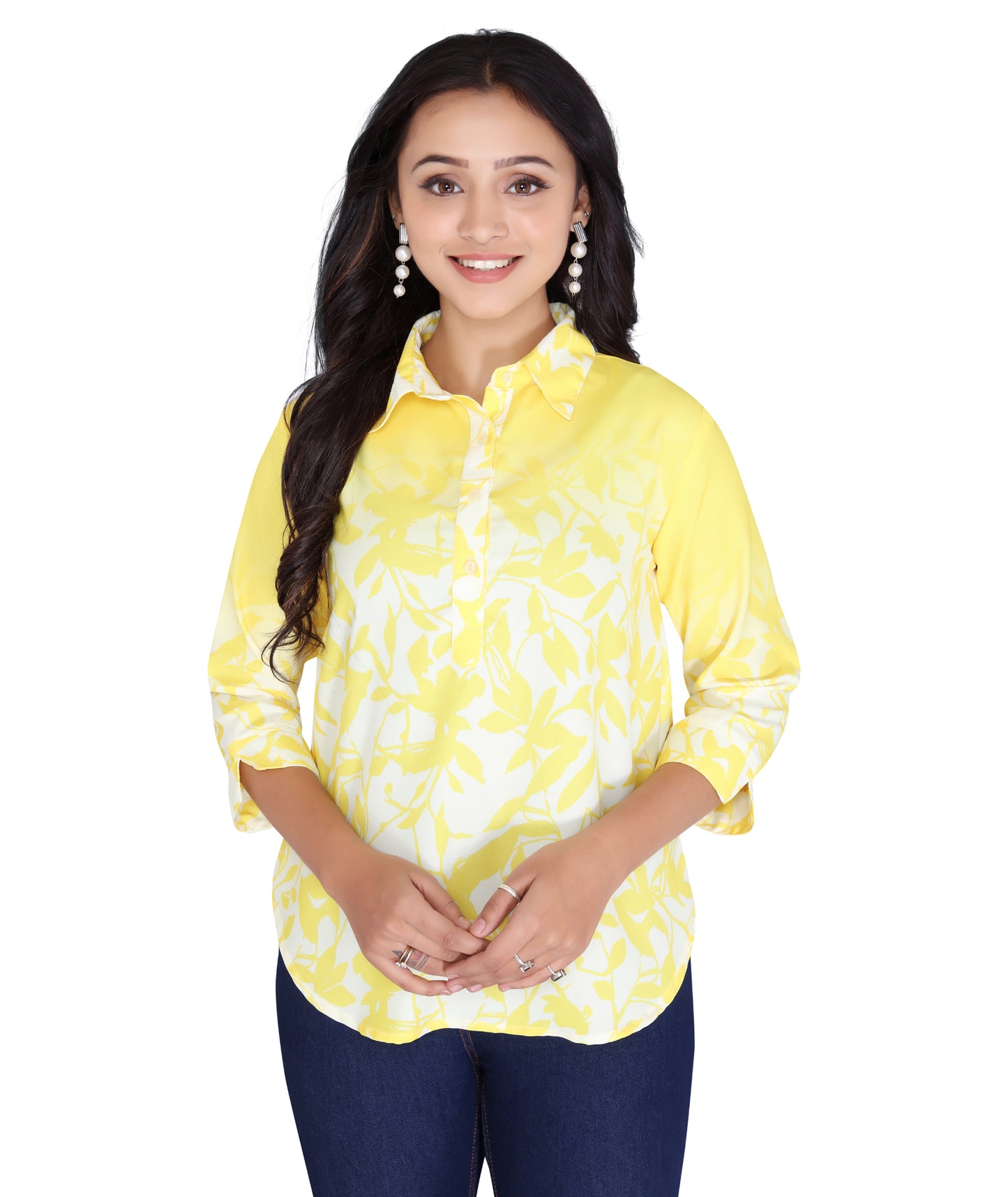 Front-facing model wearing a yellow printed polyester top with a buttoned placket and 3/4th sleeves.