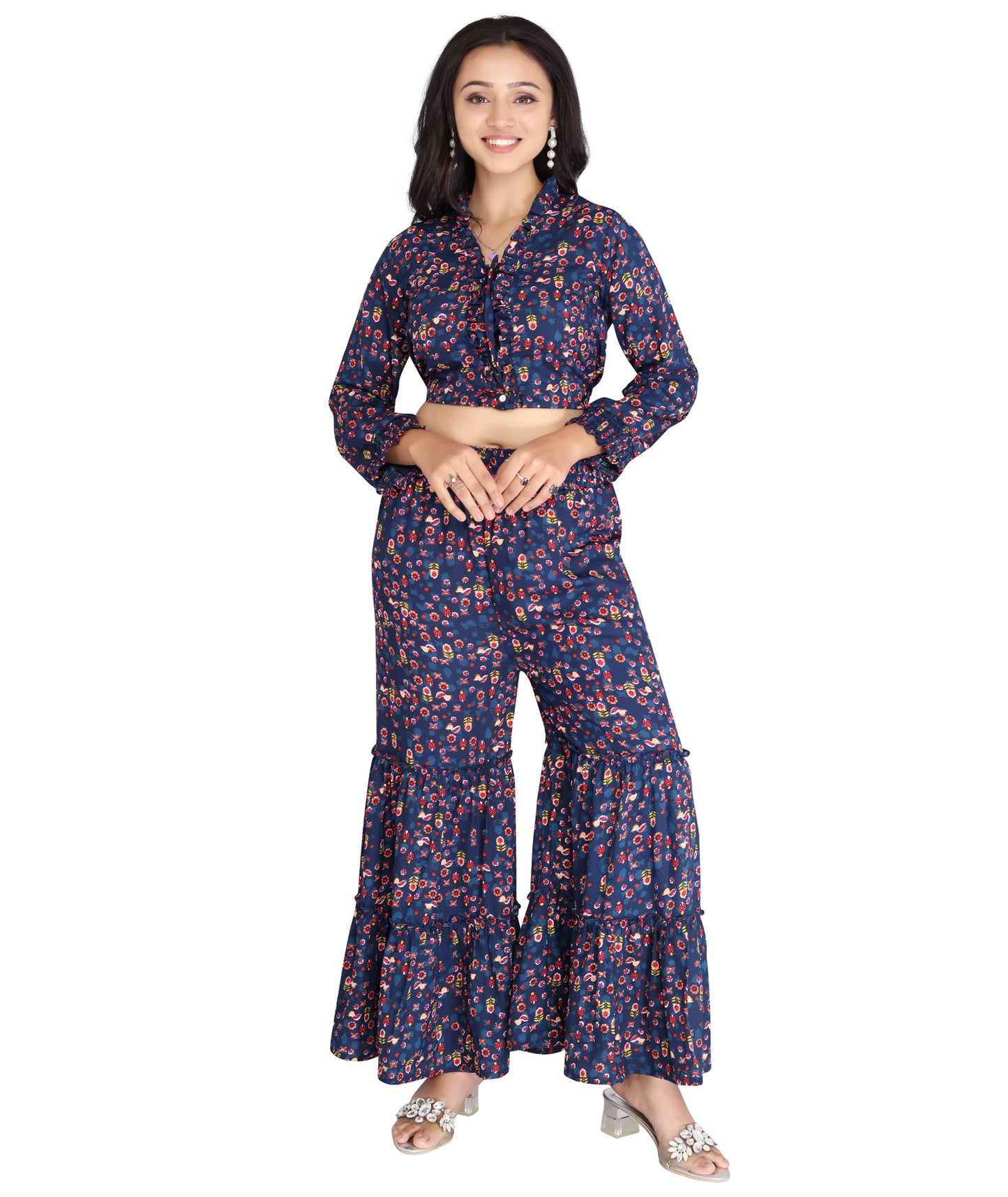 Front view of a high-quality polyester co-ord set featuring a printed crop top with ruffle details and tiered flared pants.
