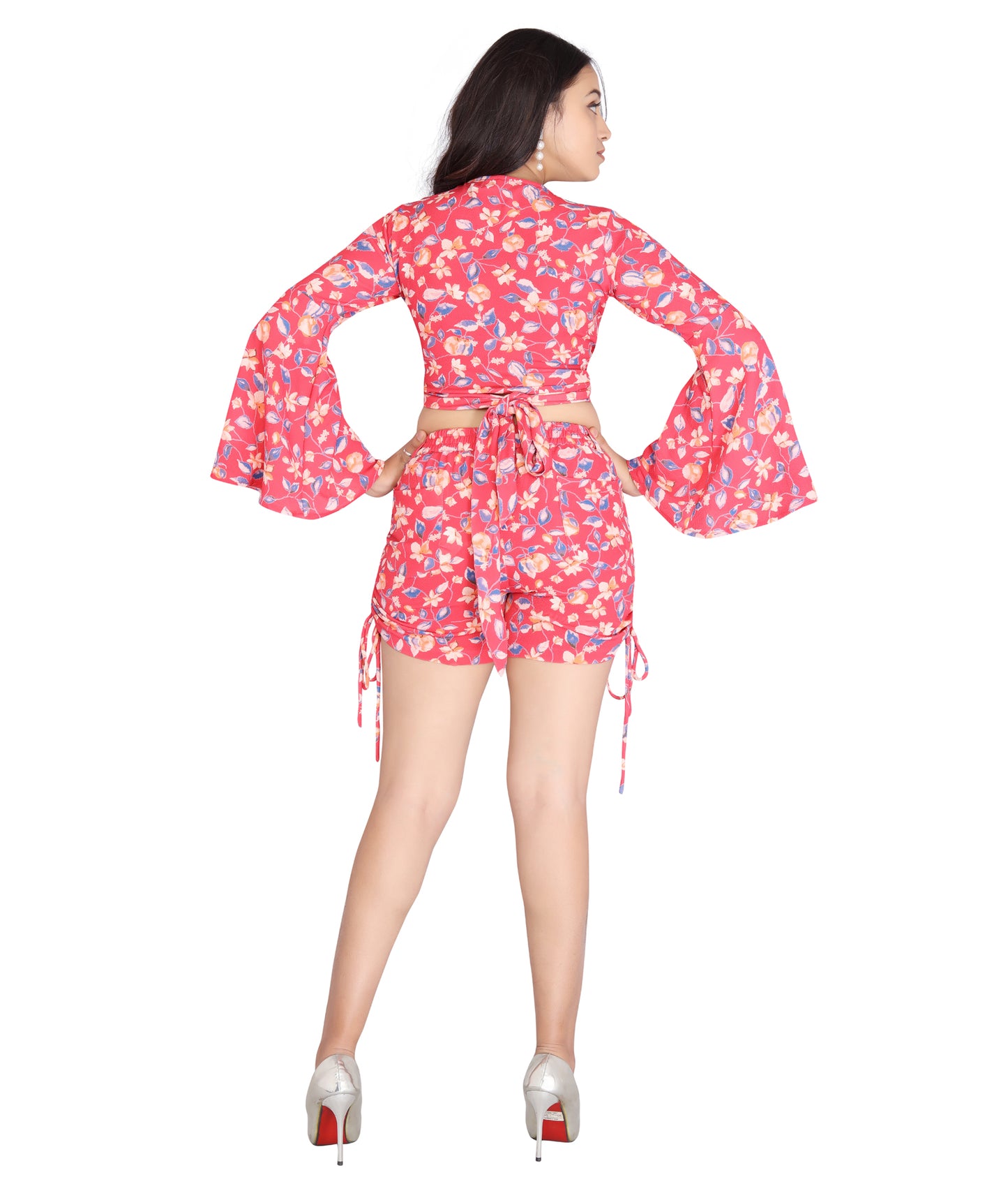 Back view of a lightweight floral printed polyester top and shorts set with bell sleeves.