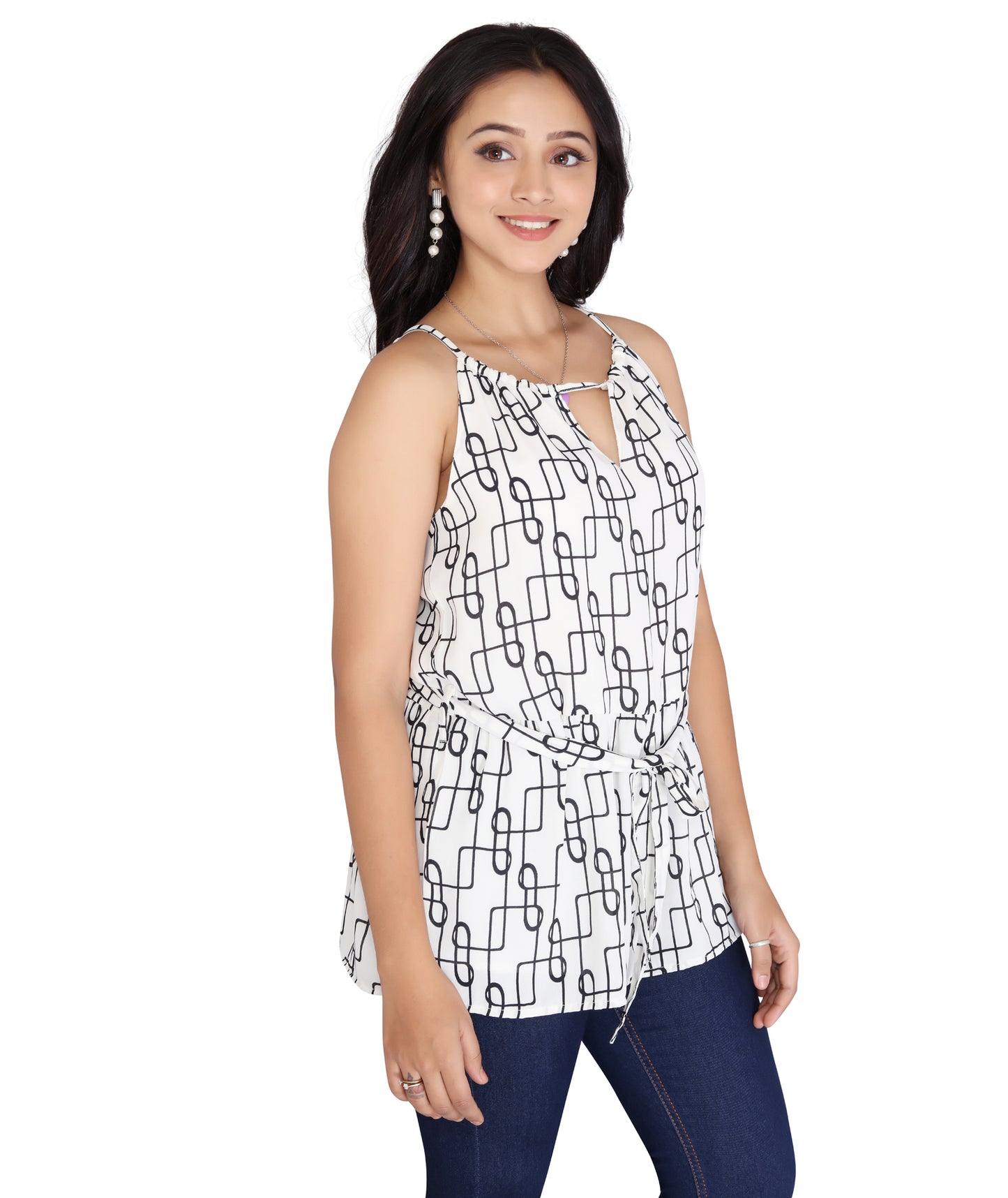 Right side view of a polyester sleeveless top featuring a chain pattern design and tie-front detailing, styled with jeans.