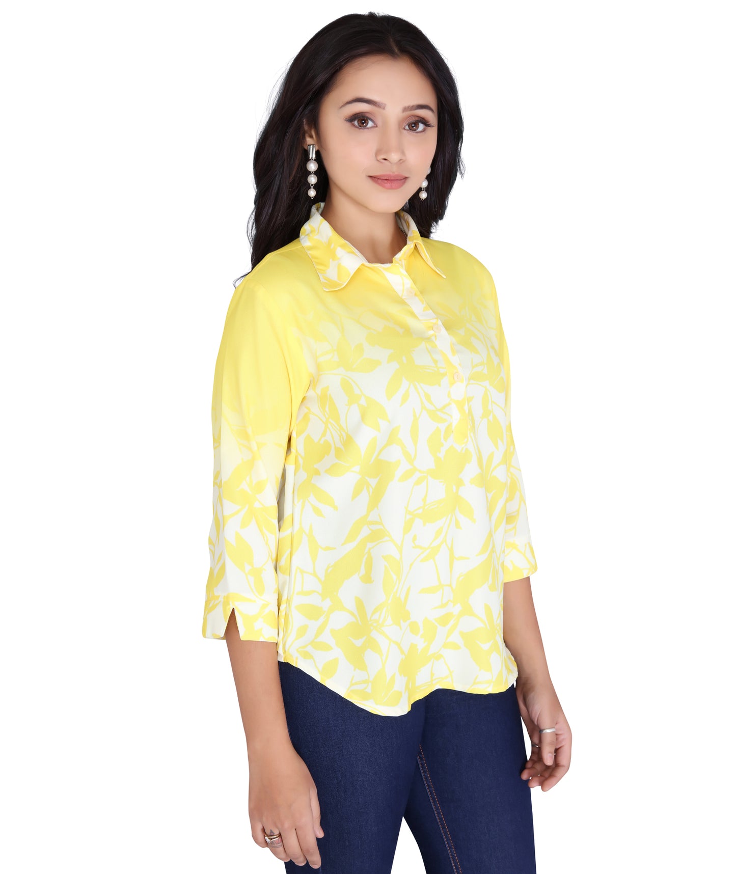 Side view of a yellow printed polyester top with a buttoned collar, highlighting its vibrant design and modern fit.