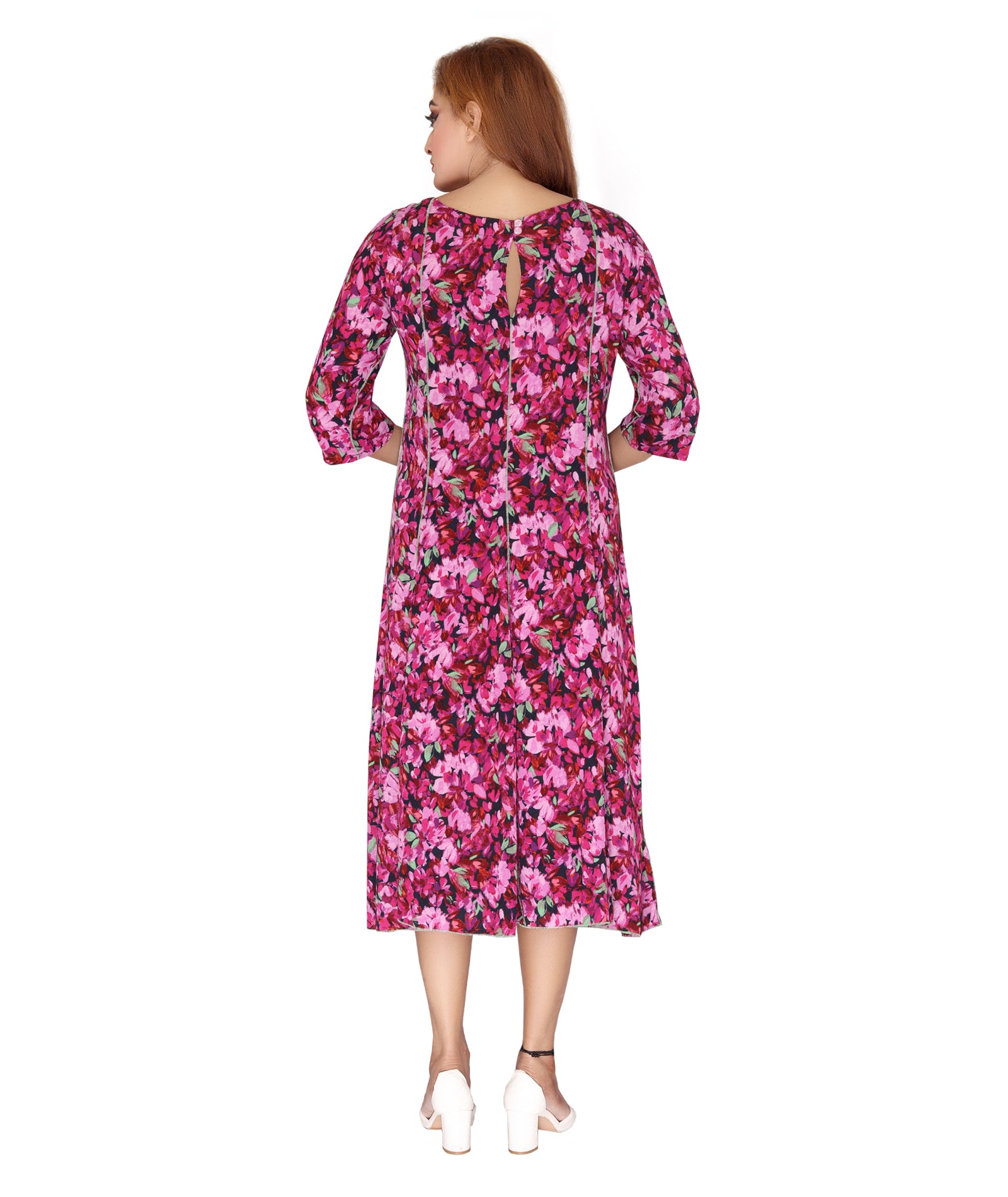 Back view of the Ladies Dress showing keyhole detail and flowy silhouette in a vibrant floral print.
