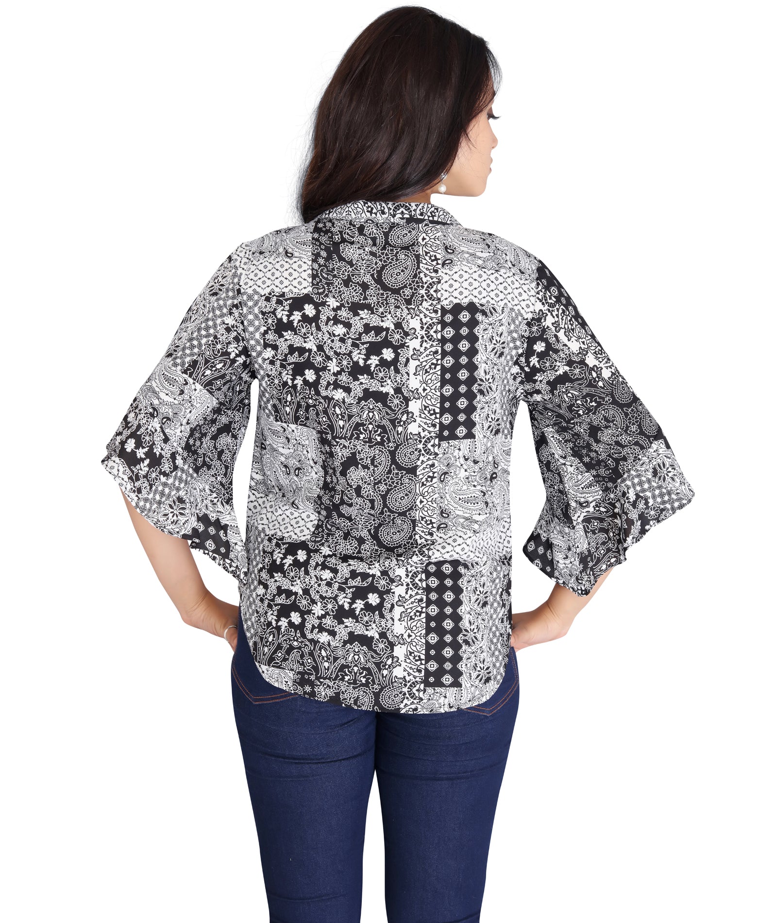 Back view of a black and white printed polyester top with a loose fit and 3/4th flared sleeves.